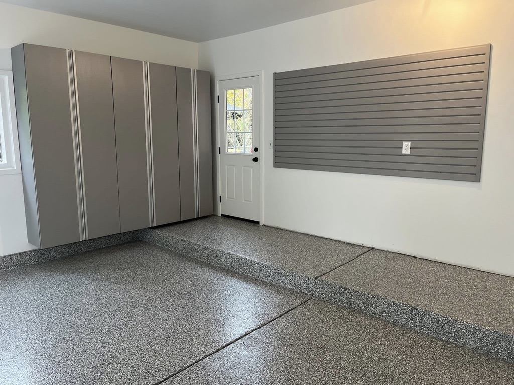 Bright polyurea flake garage floor coating installed by Fortified Concrete Coatings for a Gibraltar, Michigan area home